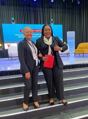Segolame Thaga with a guest on a conference stage