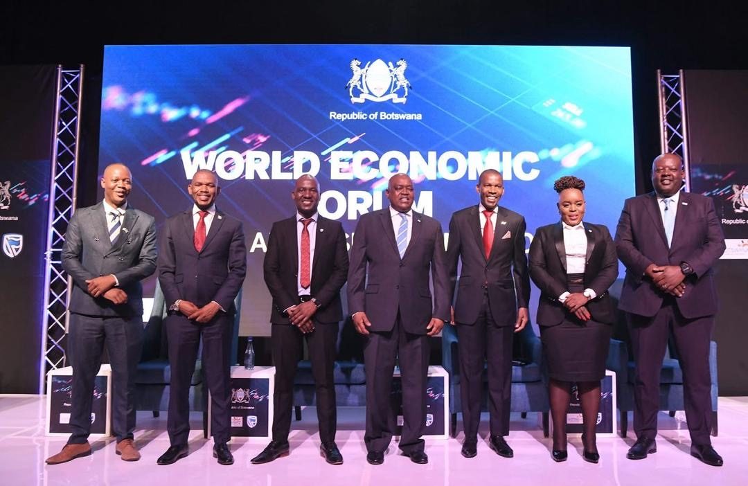 Segolame Thaga with dignitaries on stage at the World Economic Forum Post Davos Symposium