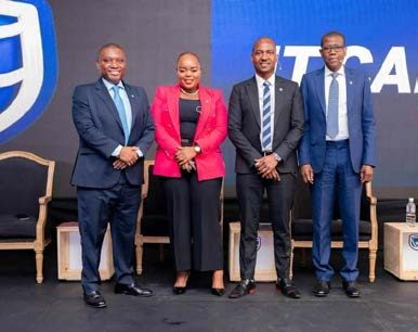 Segolame Thaga with executives on a Standard Bank stage
