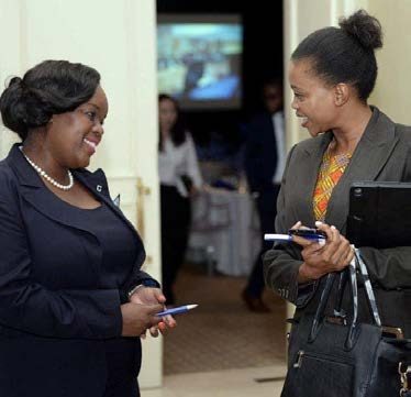 Segolame Thaga in conversation with a guest at an event