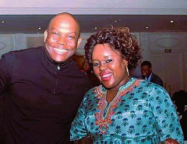 Segolame Thaga smiling with a guest at an evening event
